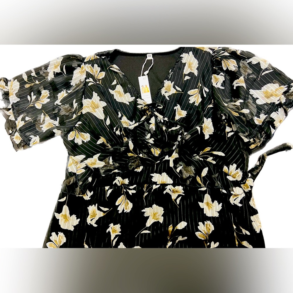 Luxury fashion and feminine statement midi dress with big bell designed sleeves.
